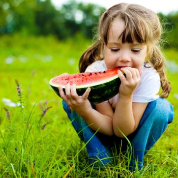 girl eating watermelon snack